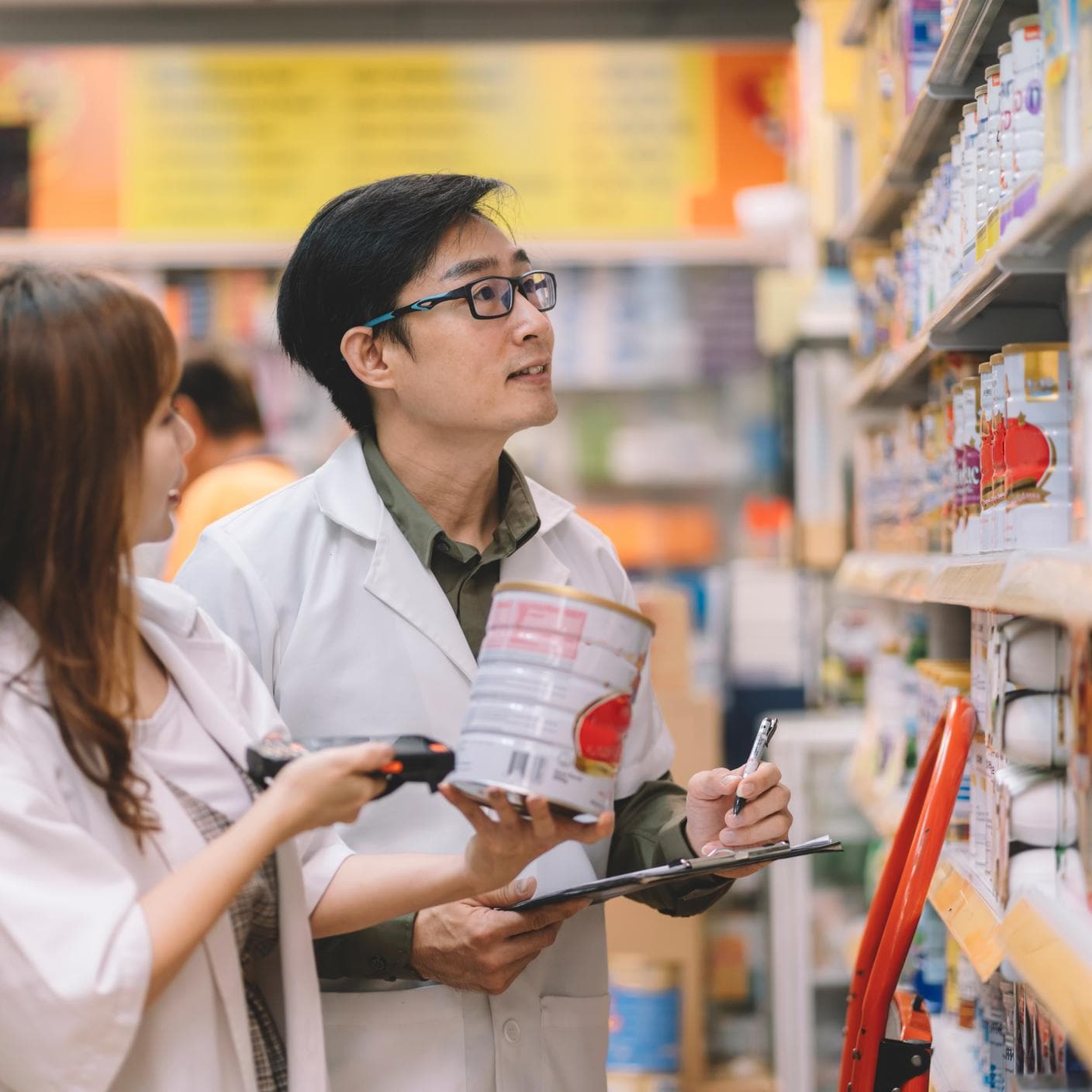 Asian Chinese pharmacist working at pharmacy store